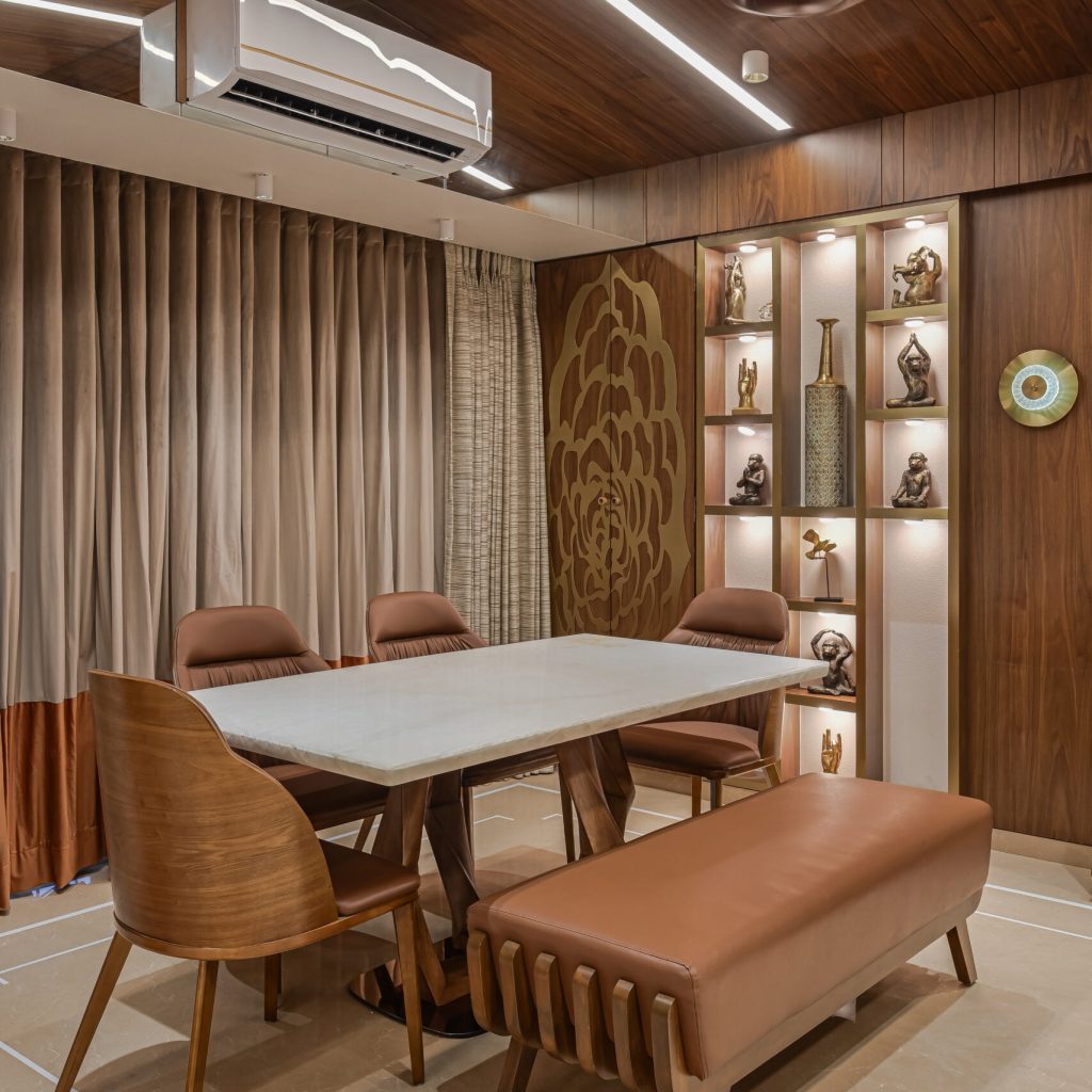 dining table in white onyx stone with a solid wood legs and plush velvet chairs in the veener